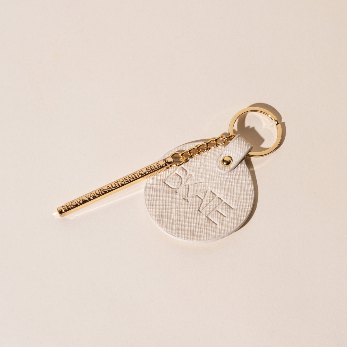 bkate, sleutelhanger, pu sleutelhanger, gouden detail sleutelhanger, beauty accessoire, laat je authentiek zelf zien, stijlvolle sleutelhanger, compacte sleutelhanger, relatiegeschenk, merk merchandise